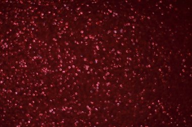 Bokeh odaklı ışıklarla kırmızı parıltılı soyut arkaplan