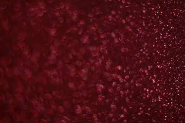 Bokeh odaklı ışıklarla kırmızı parıltılı soyut arkaplan