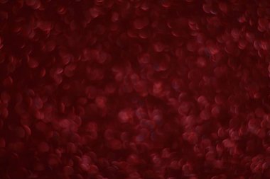 Bokeh odaklı ışıklarla kırmızı parıltılı soyut arkaplan