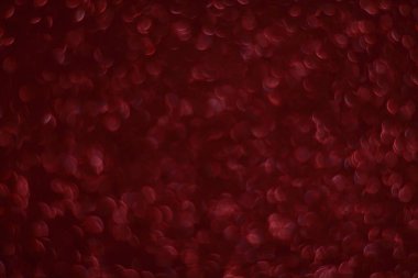 Bokeh odaklı ışıklarla kırmızı parıltılı soyut arkaplan