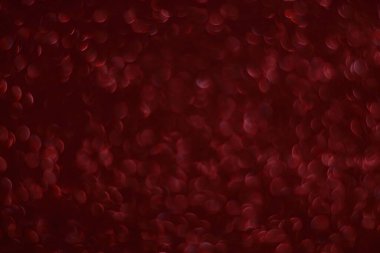 Bokeh odaklı ışıklarla kırmızı parıltılı soyut arkaplan