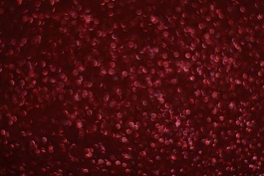 Bokeh odaklı ışıklarla kırmızı parıltılı soyut arkaplan