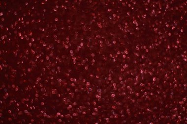 Bokeh odaklı ışıklarla kırmızı parıltılı soyut arkaplan