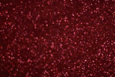 Bokeh odaklı ışıklarla kırmızı parıltılı soyut arkaplan