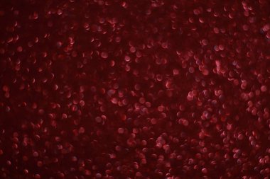 Bokeh odaklı ışıklarla kırmızı parıltılı soyut arkaplan