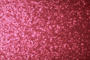 Pembe parıltılı soyut arkaplan ve Bokeh odaklı ışıklar