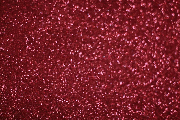 Bokeh odaklı ışıklarla kırmızı parıltılı soyut arkaplan