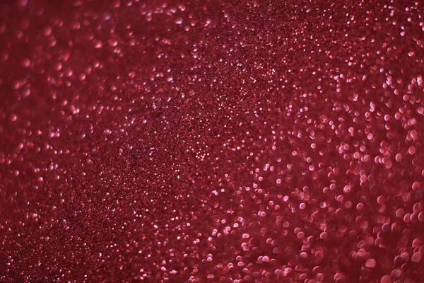 Bokeh odaklı ışıklarla kırmızı parıltılı soyut arkaplan