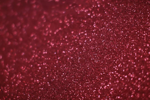 Bokeh odaklı ışıklarla kırmızı parıltılı soyut arkaplan