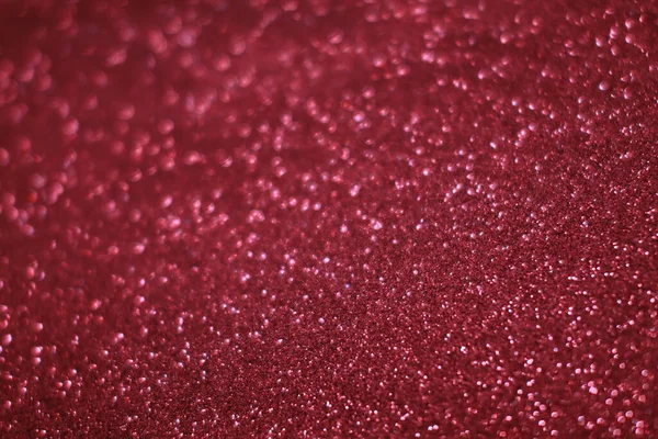 Bokeh odaklı ışıklarla kırmızı parıltılı soyut arkaplan