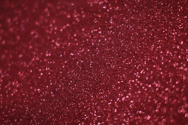 Bokeh odaklı ışıklarla kırmızı parıltılı soyut arkaplan