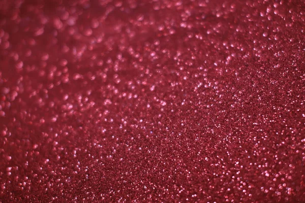 Bokeh odaklı ışıklarla kırmızı parıltılı soyut arkaplan