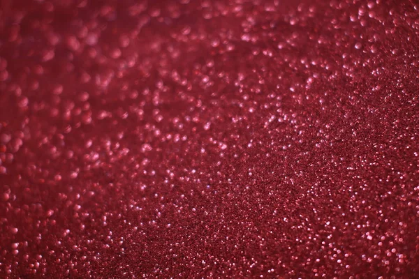 Bokeh odaklı ışıklarla kırmızı parıltılı soyut arkaplan