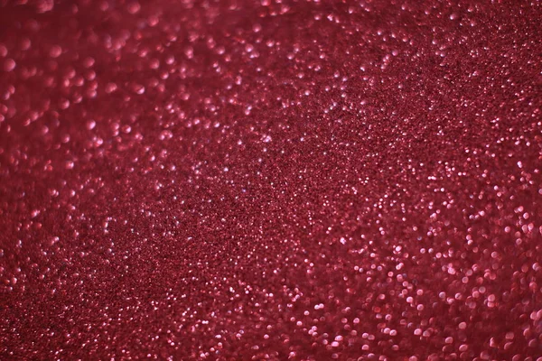 Bokeh odaklı ışıklarla kırmızı parıltılı soyut arkaplan