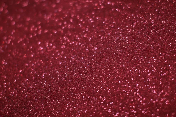 Bokeh odaklı ışıklarla kırmızı parıltılı soyut arkaplan