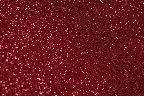 Bokeh odaklı ışıklarla kırmızı parıltılı soyut arkaplan