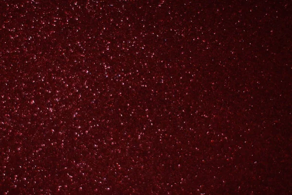 Bokeh odaklı ışıklarla kırmızı parıltılı soyut arkaplan