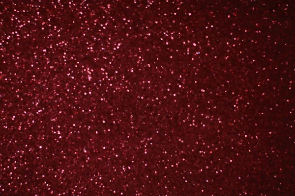 Bokeh odaklı ışıklarla kırmızı parıltılı soyut arkaplan