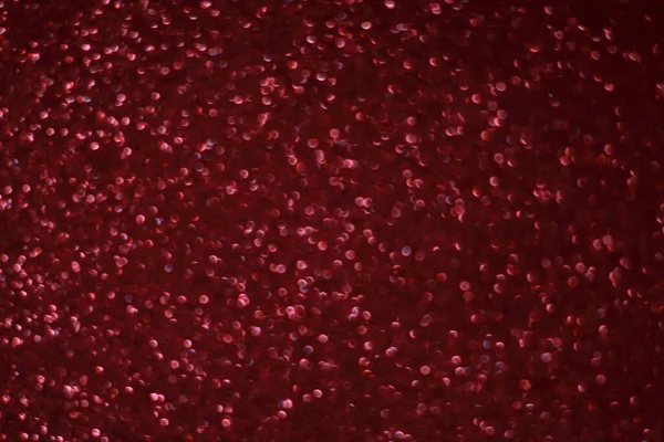 Bokeh odaklı ışıklarla kırmızı parıltılı soyut arkaplan