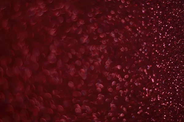 Bokeh odaklı ışıklarla kırmızı parıltılı soyut arkaplan