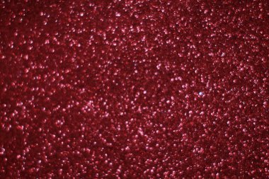 Bokeh odaklı ışıklarla kırmızı parıltılı soyut arkaplan