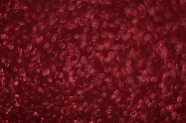 Bokeh odaklı ışıklarla kırmızı parıltılı soyut arkaplan