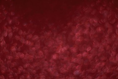 Bokeh odaklı ışıklarla kırmızı parıltılı soyut arkaplan