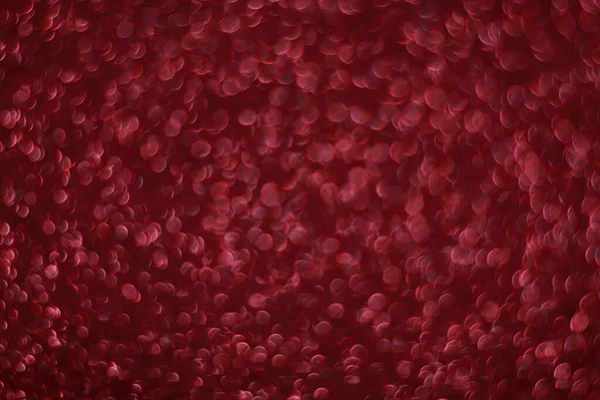 Bokeh odaklı ışıklarla kırmızı parıltılı soyut arkaplan