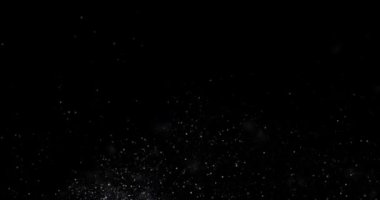 Siyah zemin üzerinde rastgele uçan küçük beyaz parçacıklara sahip video