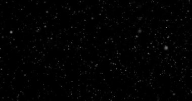 Siyah zemin üzerinde rastgele uçan küçük beyaz parçacıklara sahip video