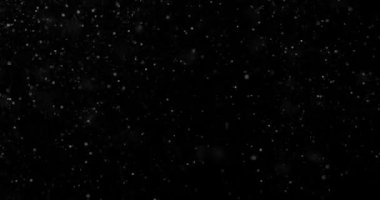 Siyah zemin üzerinde rastgele uçan küçük beyaz parçacıklara sahip video