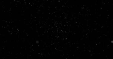 Animation with small white particles flying randomly on black background