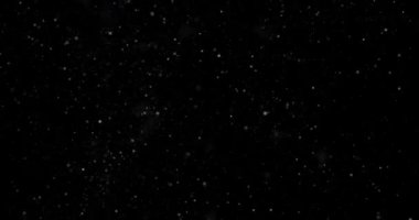 Siyah zemin üzerinde rastgele uçan küçük beyaz parçacıklara sahip video