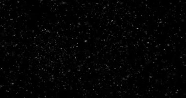 Siyah zemin üzerinde rastgele uçan küçük beyaz parçacıklara sahip video
