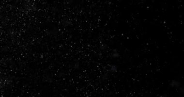 Siyah zemin üzerinde rastgele uçan küçük beyaz parçacıklara sahip video