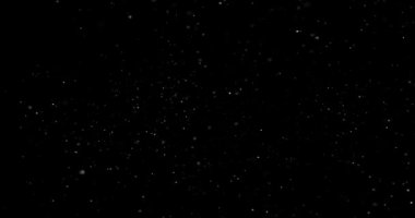 Siyah zemin üzerinde rastgele uçan küçük beyaz parçacıklara sahip video