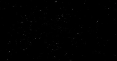 Animation with small white particles flying randomly on black background