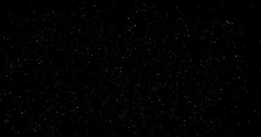 Animation with small white particles flying randomly on black background