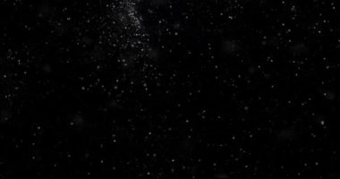 Siyah zemin üzerinde rastgele uçan küçük beyaz parçacıklara sahip video