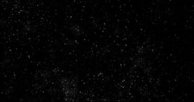 Siyah zemin üzerinde rastgele uçan küçük beyaz parçacıklara sahip video