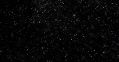 Siyah zemin üzerinde rastgele uçan küçük beyaz parçacıklara sahip video