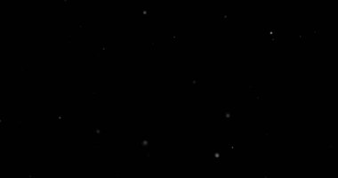 Siyah arkaplanda uçan toz parçacıkları