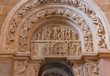 VEZELAY, FRANCE, APRIL 13, 2022 : exteriors and architectural details of portal of  Saint Mary Magadalene abbey