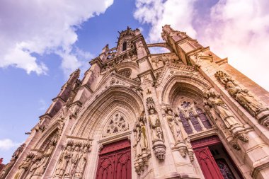 CHATEAUNEUF SUR CHER, FRANCE, APRIL 09, 2022 : exteriors and architectural details of  Our Lady of the Children basilica