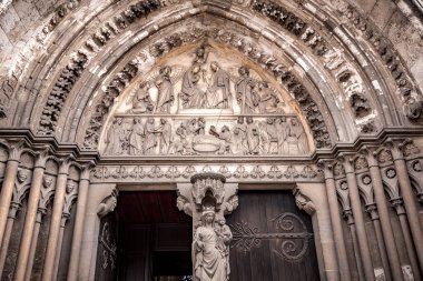 LES ANDELYS, FRANCE, APRIL 23, 2022 : exteriors and architectural details of the portal entrance of Our Lady collegiate church