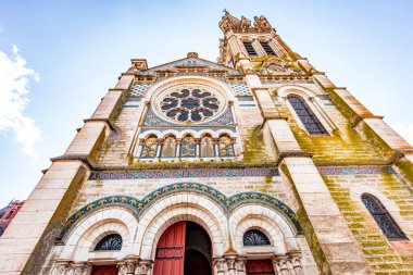 BRIARE, LOIRET, FRANCE, MAY 06, 2022 : exteriors decors and mosaics details of Saint Etienne church