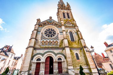 BRIARE, LOIRET, FRANCE, MAY 06, 2022 : exteriors decors and mosaics details of Saint Etienne church