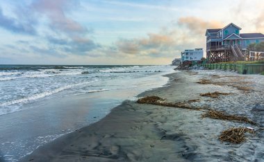 Waterfront homes along the shoreline in Folly Beach, South Carolina..