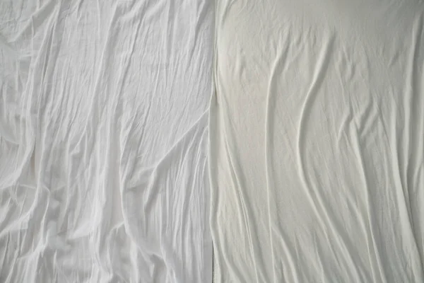 Crumpled used sheets on the bed. View from above. — Stock Photo, Image