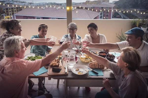 Group Mixed Ages Friends Toasting Glasses Having Dinner Evening Home — Stock Photo, Image